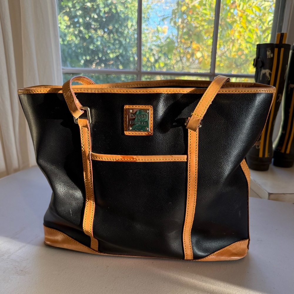 Dooney & Bourke 1975 black & tan leather exterior with Red interior.